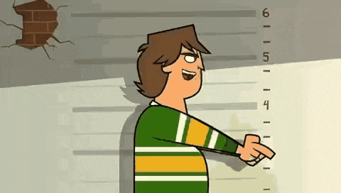 a cartoon character is pointing at a ruler that goes up to 6 feet