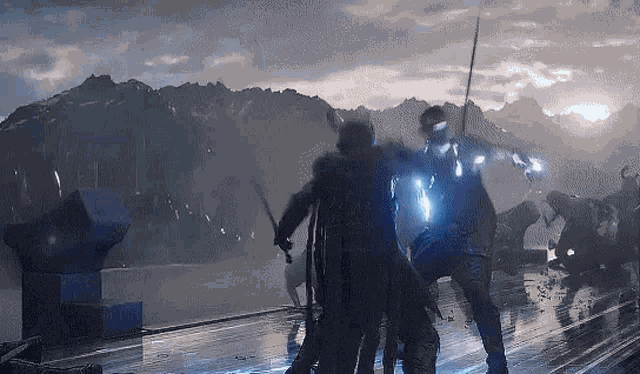 a man with a sword is fighting another man with a spear