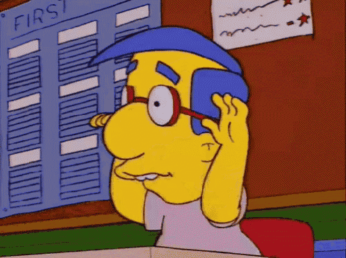 a yellow cartoon character is talking on a cell phone