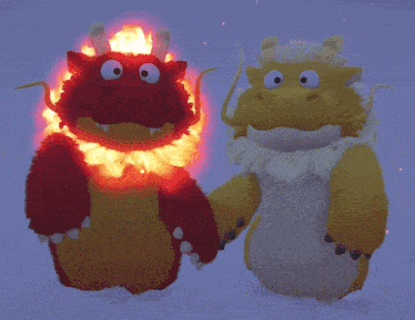 two stuffed dragons are standing next to each other with flames coming out of their heads