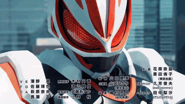a close up of a masked rider with chinese writing on it