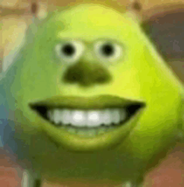 a close up of mike wazowski from monsters inc smiling with his mouth open .