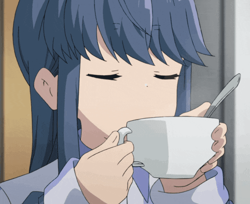 a girl with long blue hair is drinking from a white cup