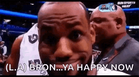 a basketball player says " l.a bron ya happy now " as he looks at the camera