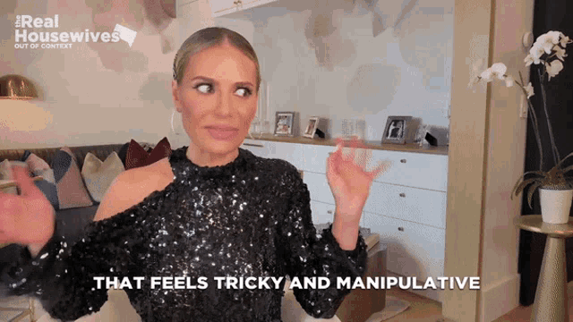 a woman says that feels tricky and manipulative while wearing a black sequined top