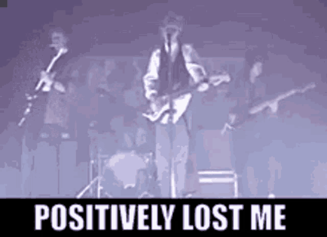 a man is playing a guitar in front of a crowd and the words positively lost me are on the bottom
