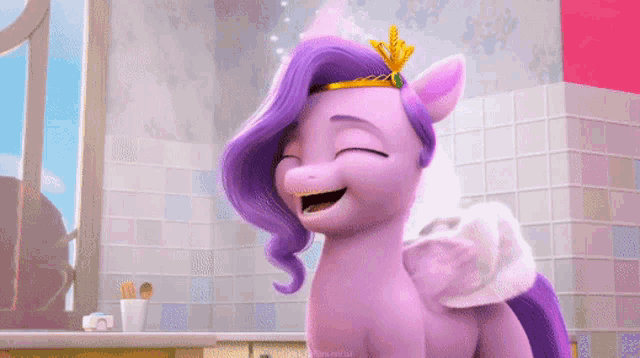 a purple pony with a crown on her head is smiling