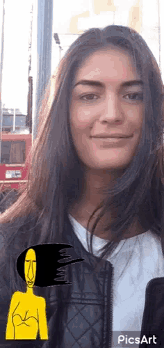 a woman with long dark hair is smiling with a yellow cartoon face behind her ..