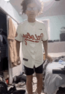 a person wearing a jersey that says ' atlanta braves ' on it