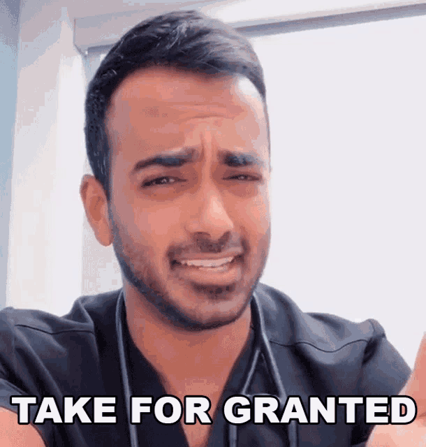 a man with a stethoscope around his neck has the words take for granted on his face