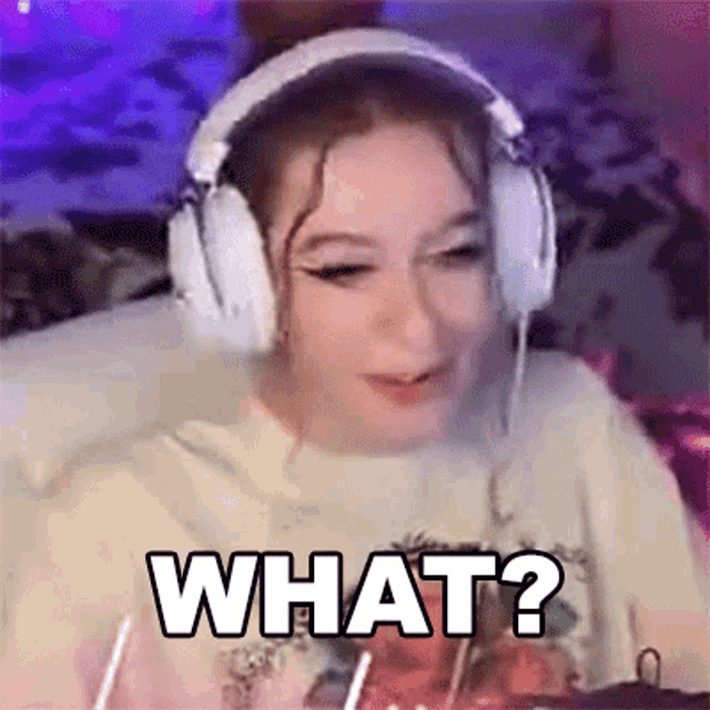 a girl wearing headphones is sitting in front of a computer and says what ?