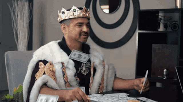 a man wearing a crown and a fur coat holds a dollar bill