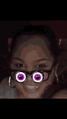 a woman wearing a pair of glasses with a cartoon face on it