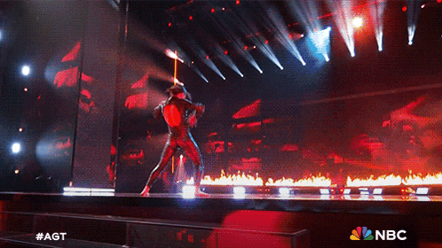a nbc ad shows a person on a stage