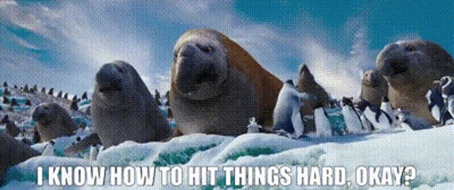 a group of seals and penguins are standing in the snow with the caption i know how to hit things hard okay