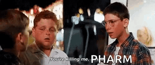 a group of young boys are talking to each other and one of them is saying `` you 're killing me , pharm ''