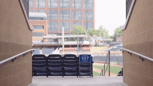 stairs leading up to a baseball stadium with a sign that says 107 on it