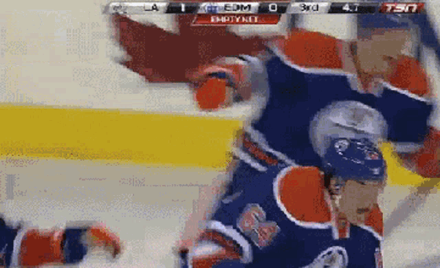 a hockey game is being played and the score is empty