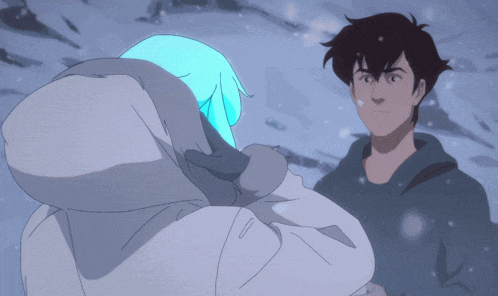 a man and a woman are standing in the snow and the woman has blue hair