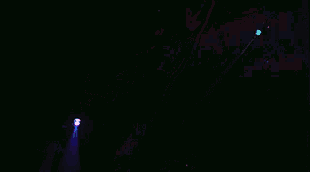 a man with his arms outstretched in the dark