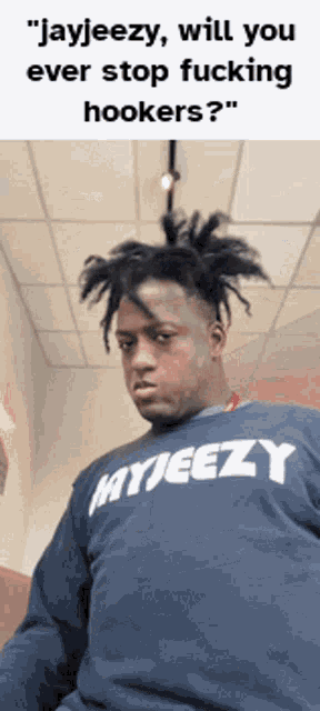 a man wearing a sweatshirt that says myjeezy