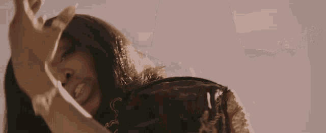 a man in a black robe is standing in the desert
