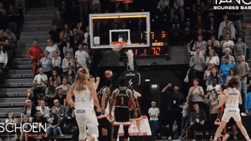 a basketball game is being played in a stadium that says schoen on the bottom