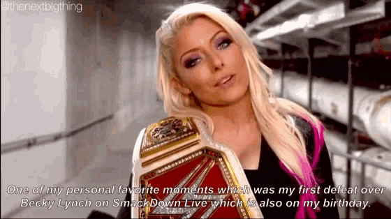 a woman is holding a wrestling belt and says one of my personal favorite moments