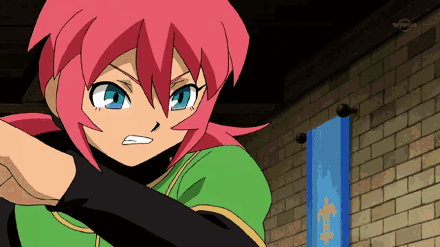 a girl with pink hair and blue eyes is standing in front of a brick wall with a blue banner hanging on it