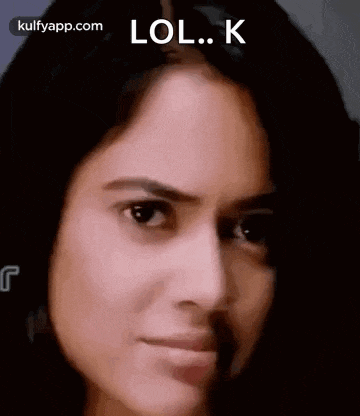 a close up of a woman 's face with the words lol . k on it .