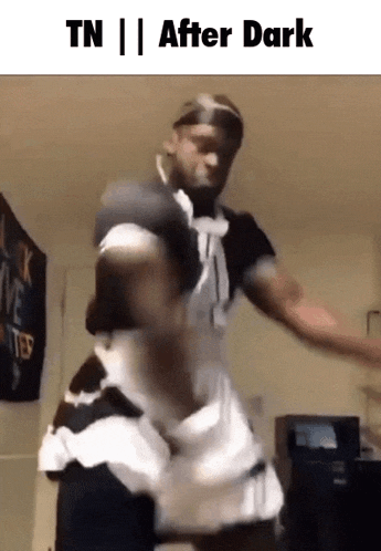 a man in a maid costume is dancing in a room with the words tn after dark on the bottom .