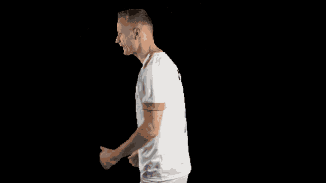 a man wearing a white shirt with the number 10 on the back