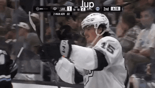 a hockey player with the number 25 on his jersey is celebrating a goal