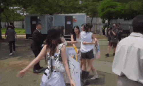 a group of people holding a sign that says ' i love you '