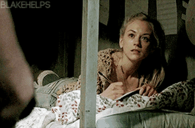 a woman is laying in a bed with blakehelps written on the bottom