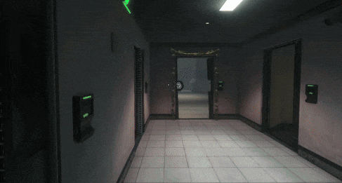 a dark hallway with a green exit sign on the right