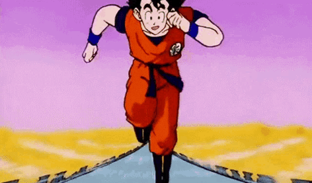 a young goku from dragon ball z is running on a road .