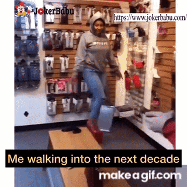 a woman in a hoodie is walking into the next decade in a store .
