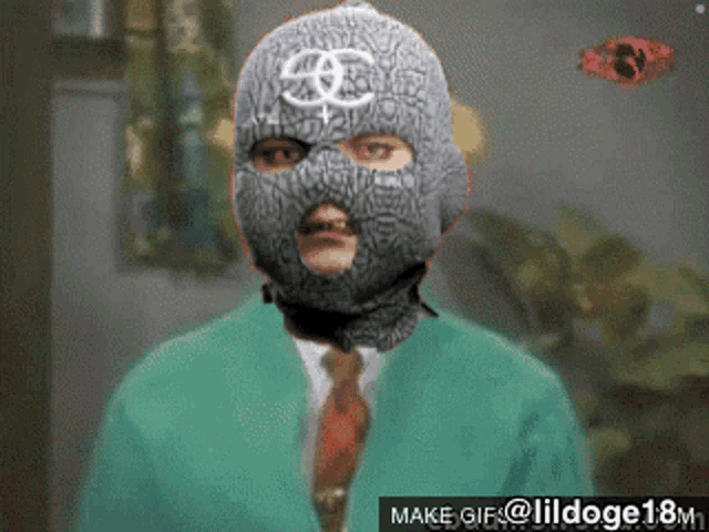 a man wearing a ski mask is being made into a gif by lildoge18m1