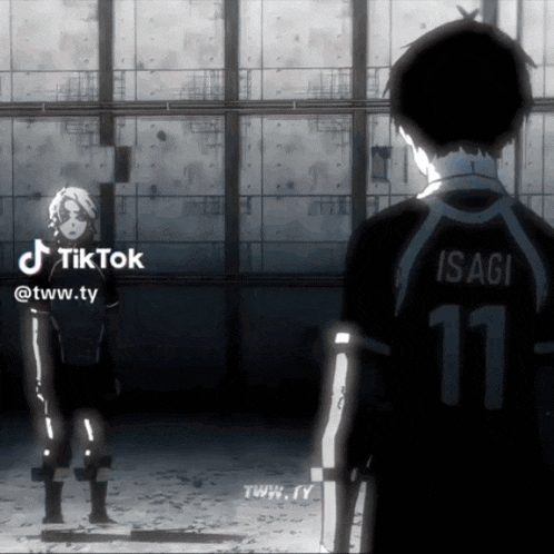 a man with the number 11 on his back is standing next to another person