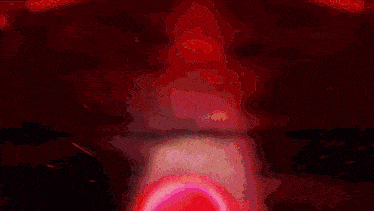 a red light is coming out of a hole in the ground