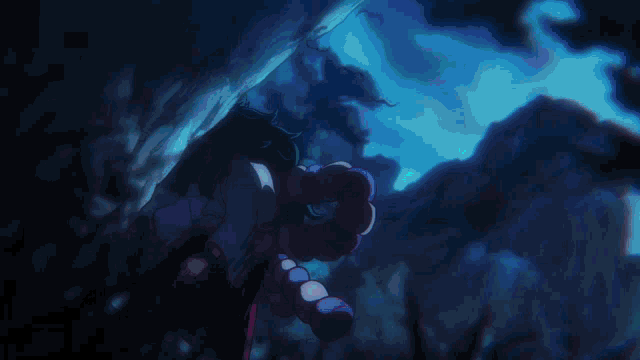a close up of a person holding a sword in the dark