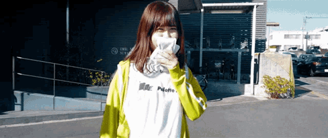 a girl wearing a white shirt that says palette