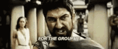 a man with a beard is standing in front of a woman and says `` for the group '' .