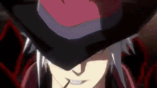 a close up of a person wearing a hat with a red heart on it