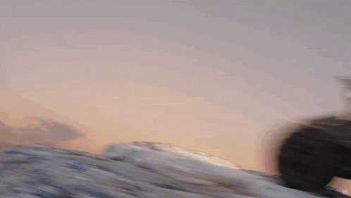 a car is going down a snow covered hill