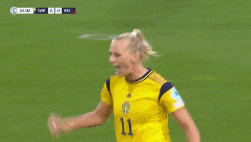 a soccer player with the number 9 on her jersey is hugging her teammates