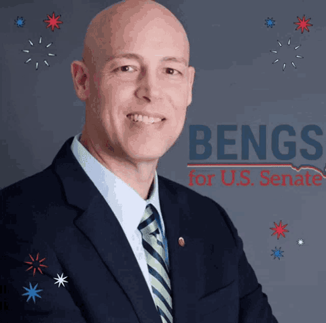 a man in a suit and tie is standing in front of a sign that says bengs for us senate