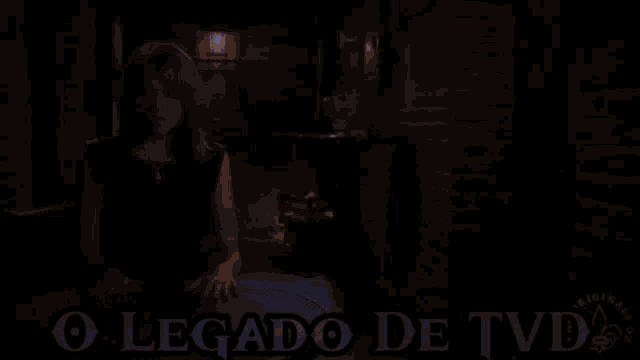 a blurry picture of a woman with her eyes closed and the words legado de tvd written below her