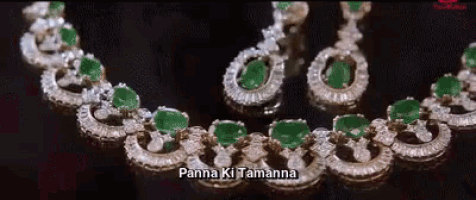 a close up of a necklace and earring set with the words panna ki tamanna